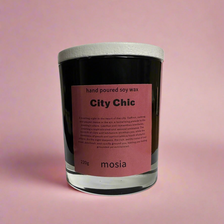 City chic candle, a luxurious scent candle with notes of saffron, nutmeg, pepper, leather and more  in a black candle jar